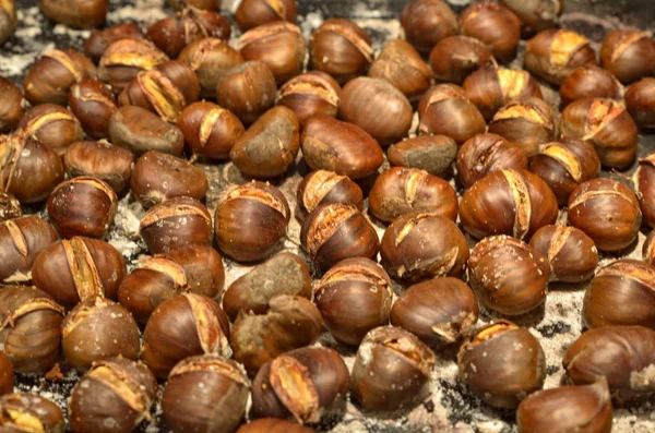 A metal baking pan filled with chestnuts roasted