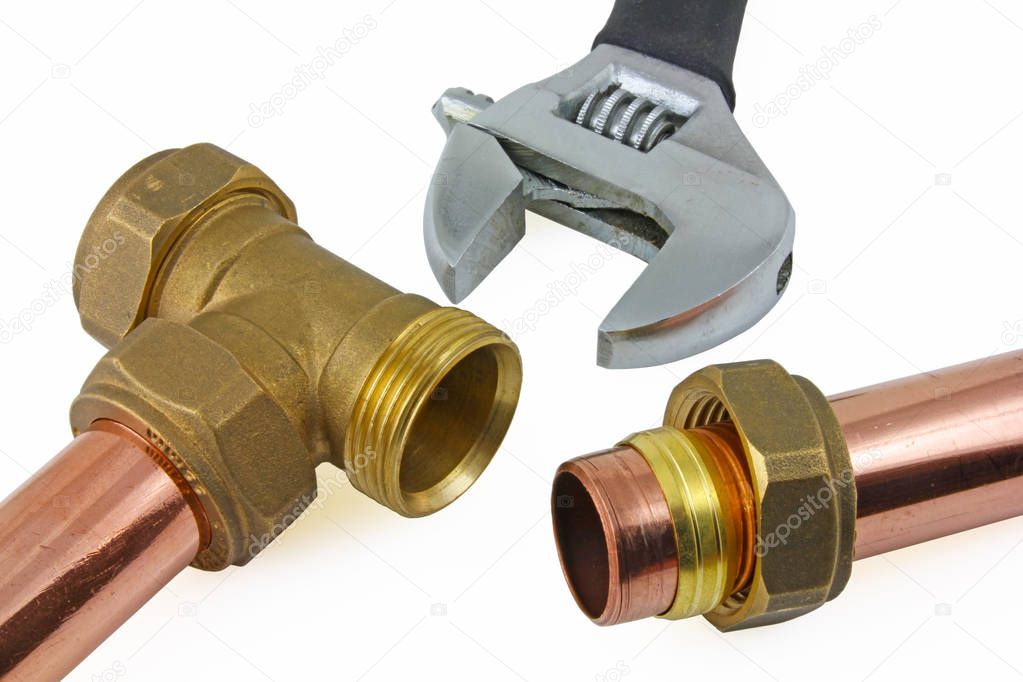 Plumbing  A view of a compression joint.  Pipe, nut,olive and brass fitting on a white  background