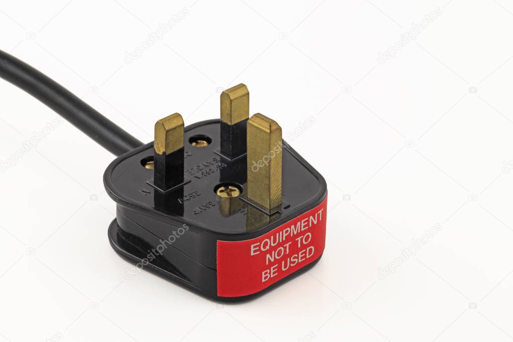 Failed pat test  An isolated uk plug with a failed sticker on a white background