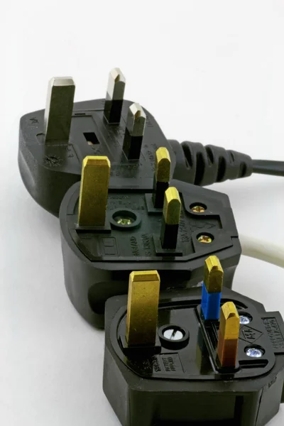 Plugs Three Domestic Appliance Plugs Laying Grey Background — Stock Photo, Image