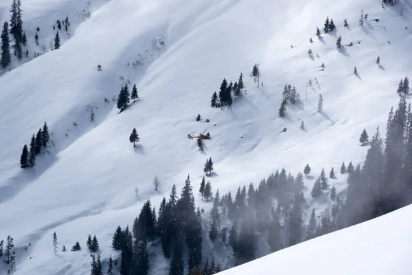 Mountain rescue helicopter above Alps, Kitzbuhel, Austria — Stock Photo, Image