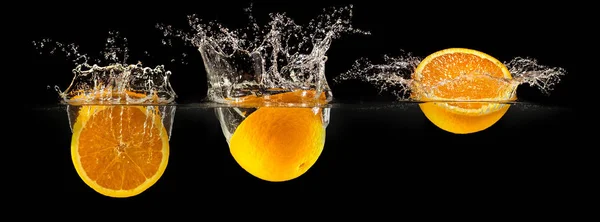 Group of fresh fruits falling in water — Stock Photo, Image