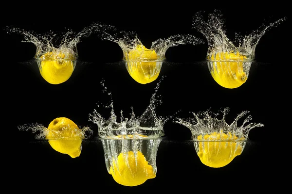 Grupo de frutas frescas caindo na água — Fotografia de Stock