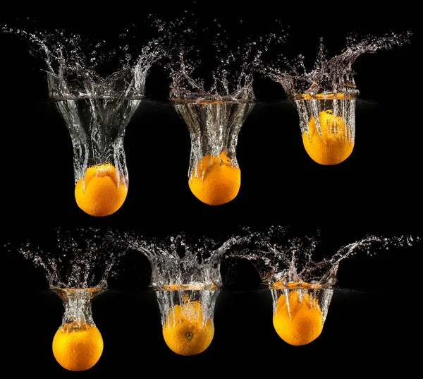 Group of fresh fruits falling in water — Stock Photo, Image