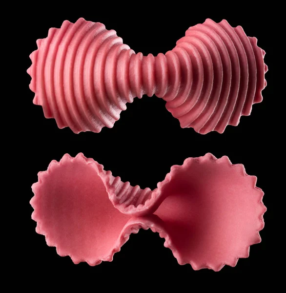 Set of pink farfalle pasta isolated on black with clipping path — 스톡 사진
