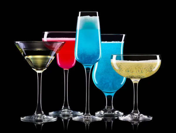 Set of different cocktail glasses for drinks on black background — Stock Photo, Image