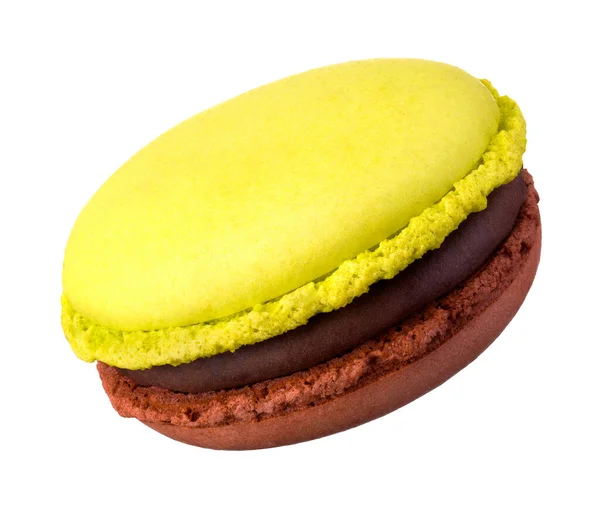 Macro photo of french caramel and pistachio macaroon isolated on white — 스톡 사진