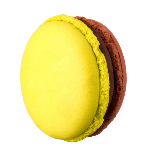 Macro photo of french caramel and pistachio macaroon isolated on white — 스톡 사진