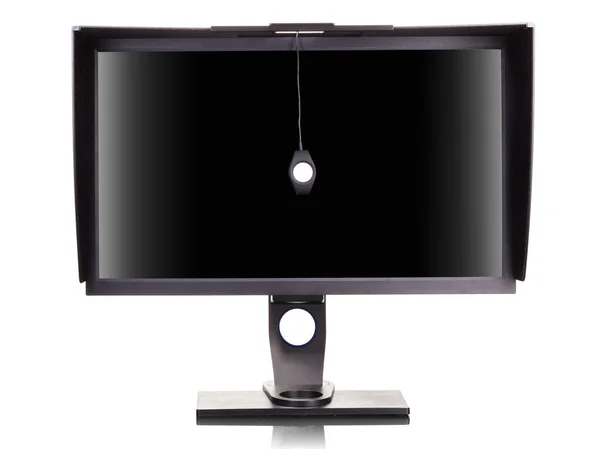 Professional monitor with shading hood and calibrator isolated on white — 图库照片