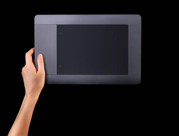 Hand holding graphic tablet for illustratorsand designers isolated on black — Stock Photo, Image