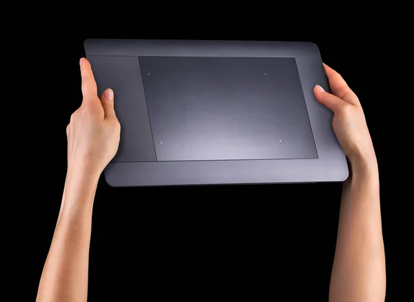 Hand holding graphic tablet for illustratorsand designers isolated on black — Stock Photo, Image