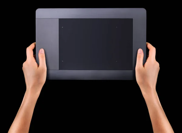 Grafik-Tablet für Illustratoren und Designer in der Hand, isoliert auf Schwarz — Stockfoto