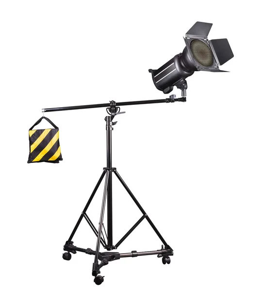 Photography studio flash on a lighting stand isolated on white background with lamp. Proffetional equipment like monobloc or monolight
