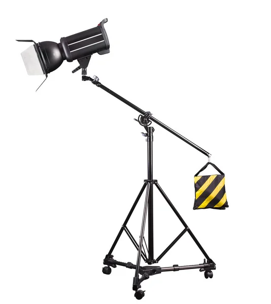 Photography studio flash on a lighting stand isolated on white background with lamp. Proffetional equipment like monobloc or monolight