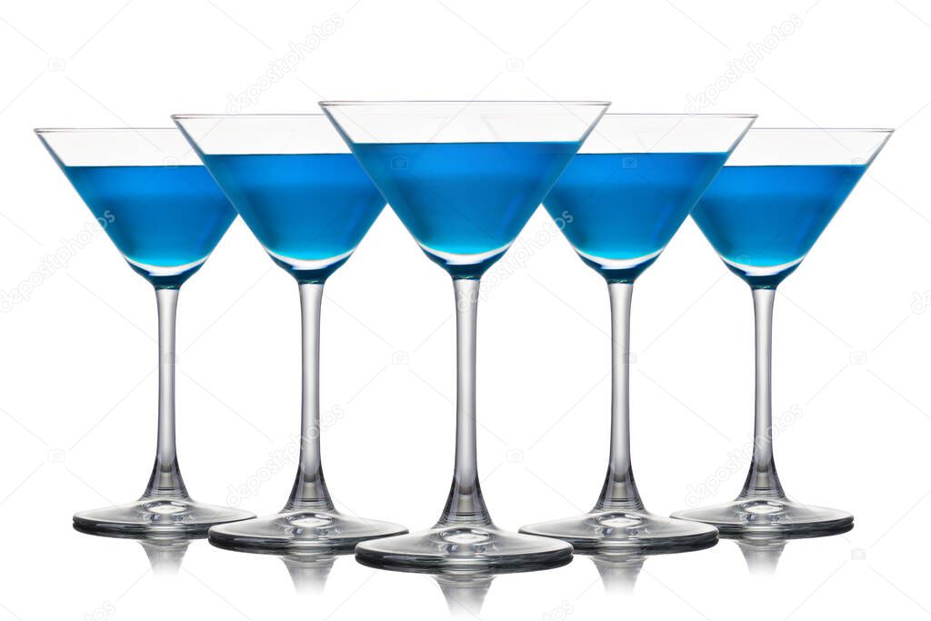 Set of Blue Curacao cocktail in martini glasses isolated on white background.