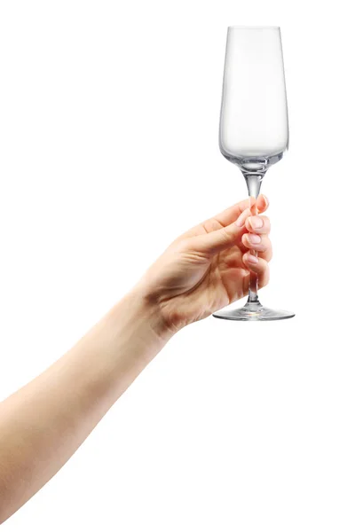 Donna mano tenendo vuoto bicchiere di champagne isolato su bianco . — Foto Stock