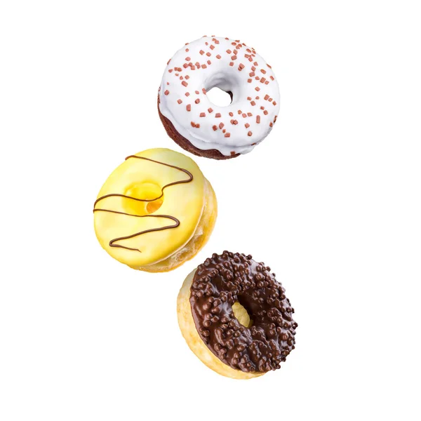 Set fliegender glasierter Donuts mit Streusel auf weißem Hintergrund — Stockfoto