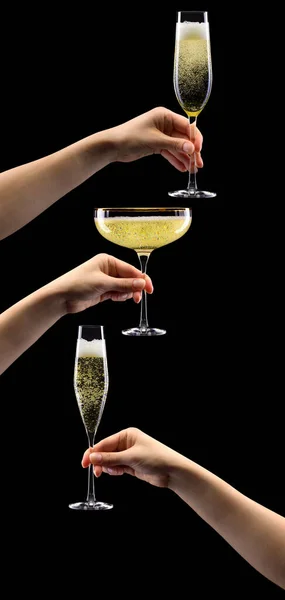 Set di mani che tengono il bicchiere di champagne frizzante isolato su nero . — Foto Stock