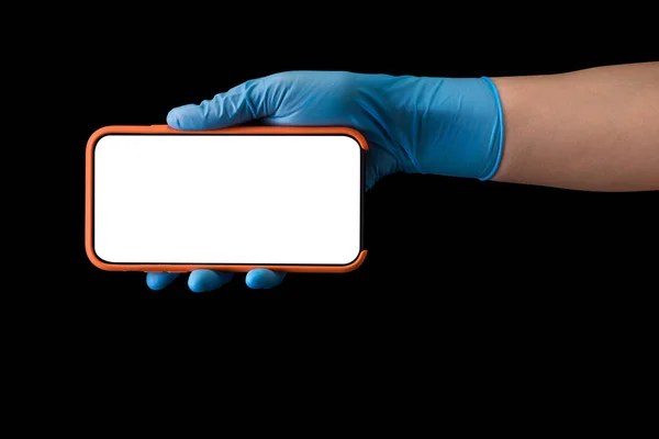 Doctor Hand Sterile Medical Gloves Holding Phone Isolated Black Background — Stock Photo, Image