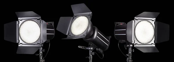 Set of photography studio flash isolated on black background with lamp. Proffetional equipment like monobloc or monolight