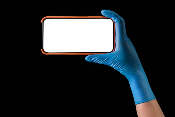 Doctor Hand Sterile Medical Gloves Holding Phone Isolated Black Background — Stock Photo, Image