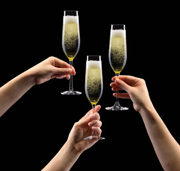Ein Satz Hände Die Ein Glas Champagner Auf Schwarzem Hintergrund — Stockfoto