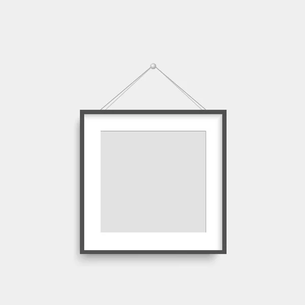 Realistic black photo frame hanging on th wall. Vector. — Stock Vector