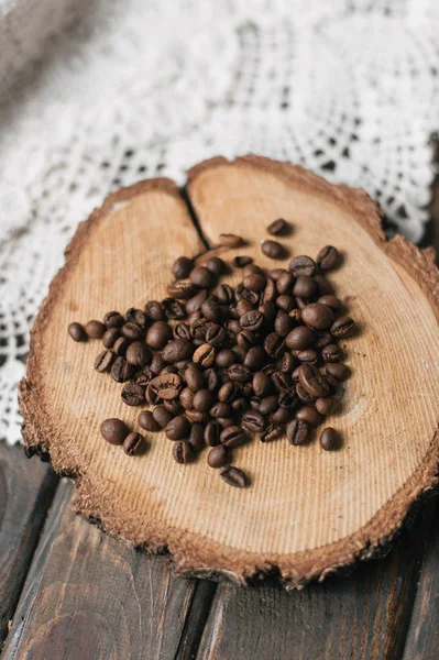 A pile of coffee beans on cross section of the tree