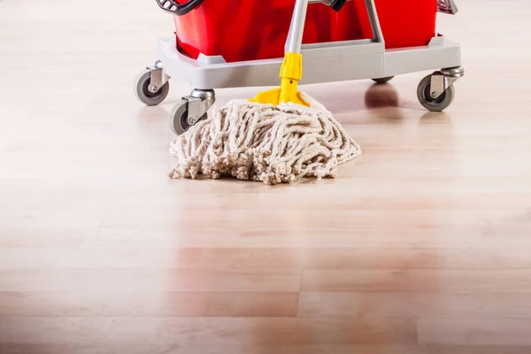 Cleaning the floor with mop Royalty Free Stock Images