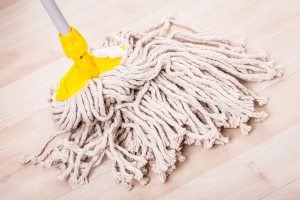 Mop head on wooden floor — Stock Photo, Image