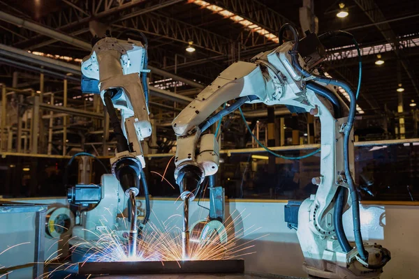 Industrial welding robots are movement in production line factory