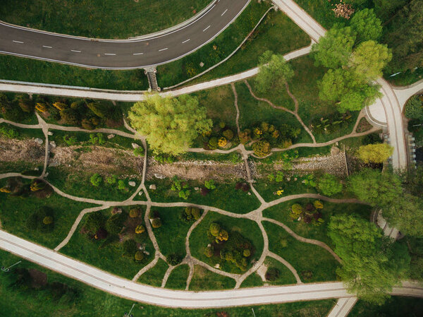 Aerial view of beautiful green park and road