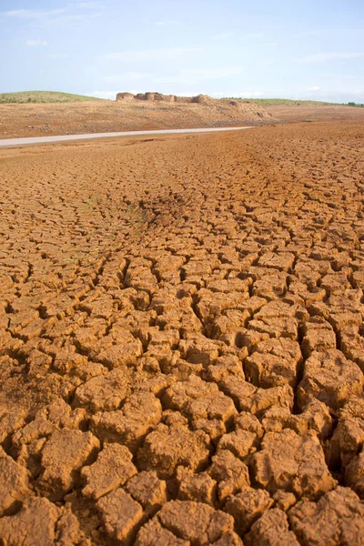 Cracked parched earth with fort — Stock Photo, Image