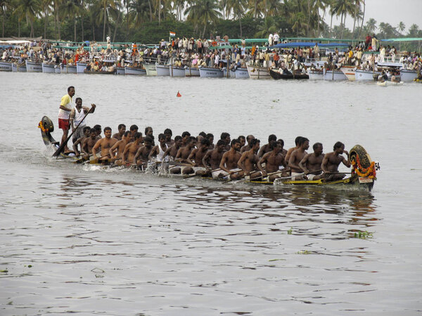 Punnamada lake, Alappuzha, Kerala. August, 2008. Held every year on the second Saturday of August. People gather in large numbers to watch nearly 100 ft long boats compete against each other to the tune of old boat songs on Punnamada lake