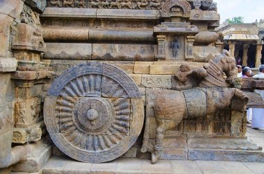 Carved stone chariot on the outer wall of Airavatesvara Temple, Darasuram, near Kumbakonam, Tamil Nadu, India.  clipart