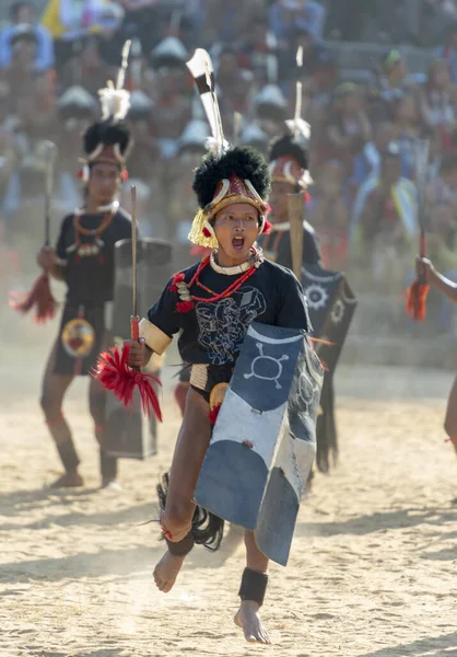 Nagaland, India, December 2013, Naga Warrior playing games during Hornbill Festival — стокове фото