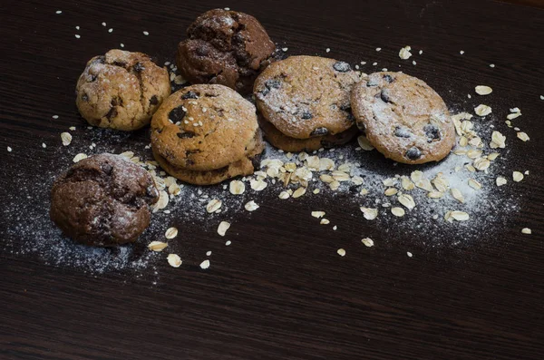 Cookies Chocolate Dark Background Sugar Powder Oat Flakes Seasame — Stock Photo, Image