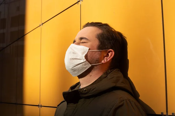 tired man in mask, coronavirus, illness, infection, quarantine, medical mask
