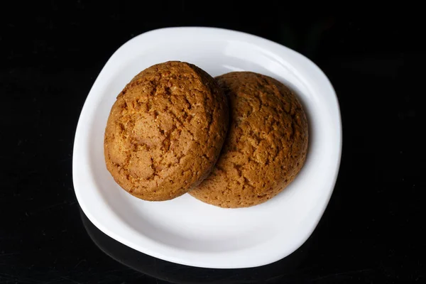 Two oatmeal  cookies on a plate — Stock Photo, Image