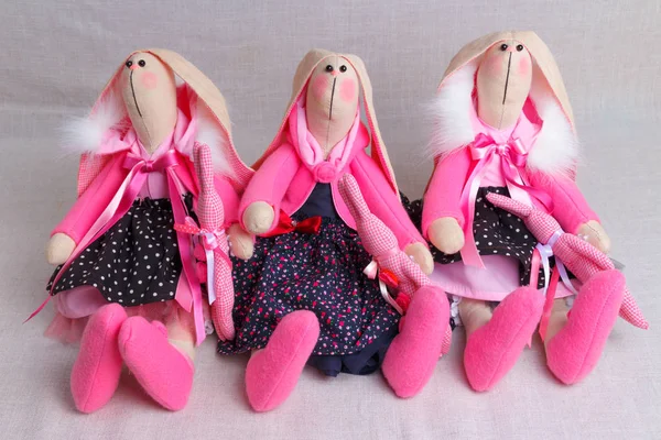 many toy rabbits in dresses, easter