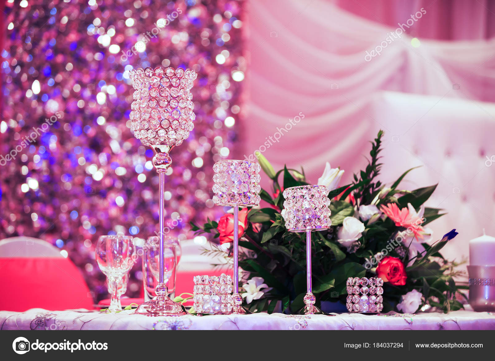 Beautiful glasses on banquet table. Decoration glasses for the wedding  ceremony on the table against the