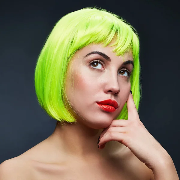 Portrait of woman in green wig and red lips