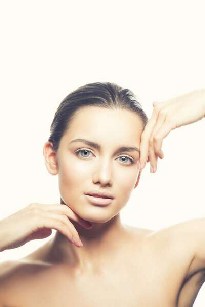 Portrait of young woman with natural makeup on white background