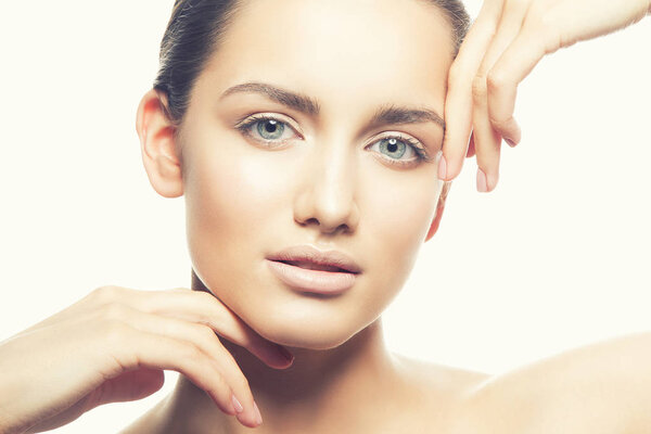 Portrait of young woman with natural makeup on white background