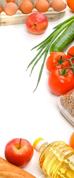 Food delivery, donation, food supply, copyspace. On a white background, buckwheat, pasta, sugar, peas, canned food, tomatoes, cucumber bread orange apple eggs ginger package coronavirus quarantine