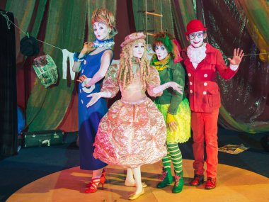 Moscow, Russia, May 16, 2015. Group of clowns on stage in the image. Theatrical clowning and Comedy make-up mass. The troupe of like-minded people was founded by Pavel Ivanov.
