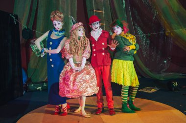 Moscow, Russia, May 16, 2015. Group of clowns on stage in the image. Theatrical clowning and Comedy make-up mass. The troupe of like-minded people was founded by Pavel Ivanov.