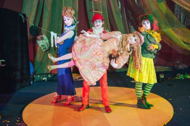 Moscow, Russia, May 16, 2015. Group of clowns on stage in the image. Theatrical clowning and Comedy make-up mass. The troupe of like-minded people was founded by Pavel Ivanov.