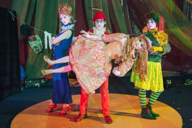 Moscow, Russia, May 16, 2015. Group of clowns on stage in the image. Theatrical clowning and Comedy make-up mass. The troupe of like-minded people was founded by Pavel Ivanov.