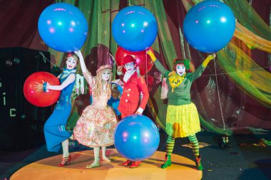 Moscow, Russia, May 16, 2015. Group of clowns on stage in the image. Theatrical clowning and Comedy make-up mass. The troupe of like-minded people was founded by Pavel Ivanov.